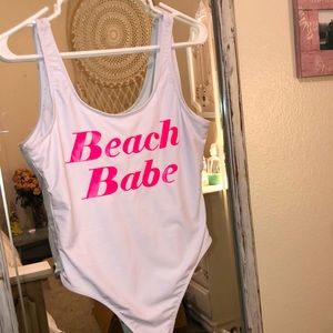 Stand out with this one piece Revamped swimsuit! White/bright pink